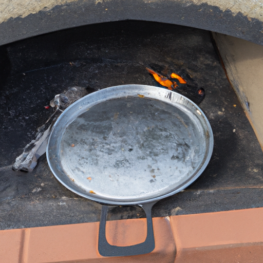 A cast iron Dutch oven placed over hot coals, ready for cooking a delicious pizza.